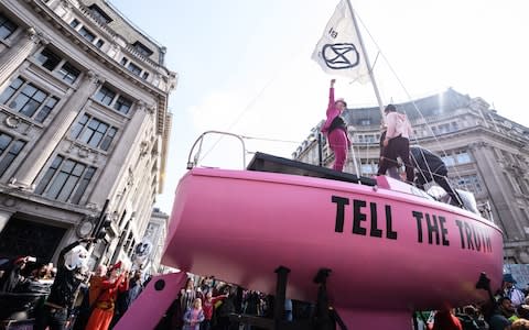 A boat is placed in the centre of the traffic junction as Environmental campaigners block Oxford Circus - Credit: Leon Neal/Getty Images