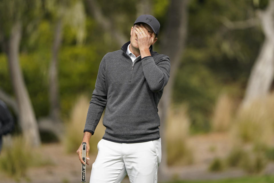 Jordan Spieth reacts after missing an eagle putt on the second green of the Pebble Beach Golf Links during the final round of the AT&T Pebble Beach Pro-Am golf tournament Sunday, Feb. 14, 2021, in Pebble Beach, Calif. (AP Photo/Eric Risberg)