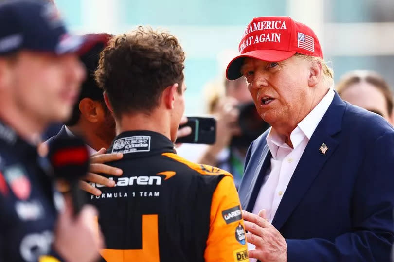 MIAMI, FLORIDA - MAY 05: Donald Trump talks with Race winner Lando Norris of Great Britain and McLaren in parc ferme during the F1 Grand Prix of Miami at Miami International Autodrome on May 05, 2024 in Miami, Florida. (Photo by Mark Thompson/Getty Images)