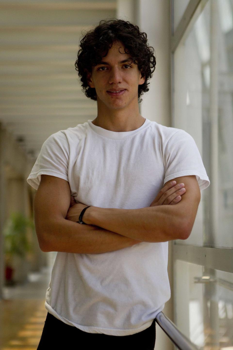 In this Aug. 15, 2012 photo, Isaac Hernandez, Mexico's most internationally acclaimed male ballet dancer, poses for a portrait between rehearsals in Mexico City. Hernandez wants to change ballet in Mexico and aims to lead his countrymen to the practice barre in hopes they will grab on and get hooked, just as he did as a boy. (AP Photo/Dario Lopez-Mills)