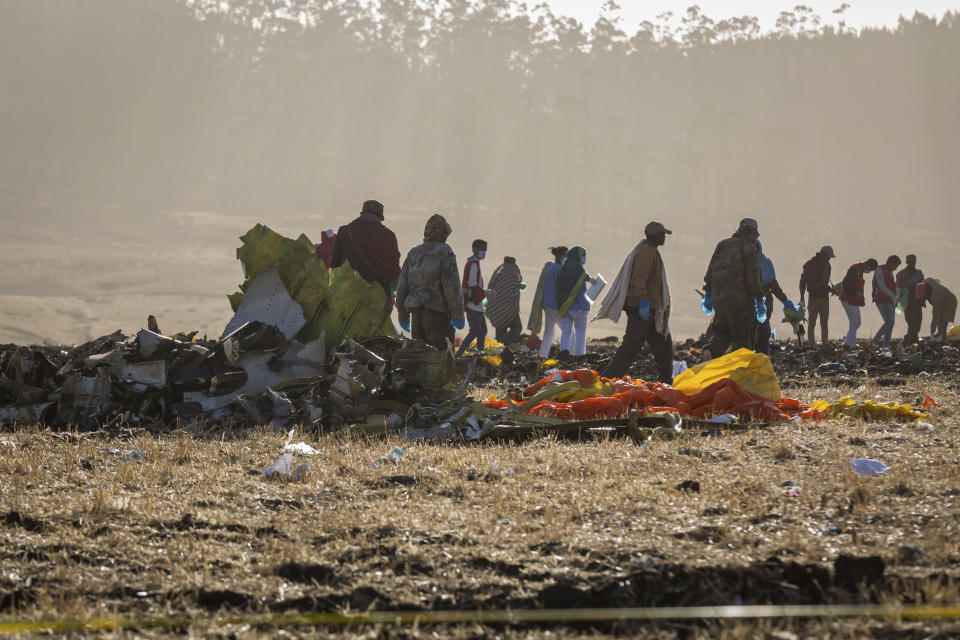 Rescuers work at the scene of an Ethiopian Airlines flight crash near Bishoftu, or Debre Zeit, south of Addis Ababa, Ethiopia, Monday, March 11, 2019. (AP Photo/Mulugeta Ayene)