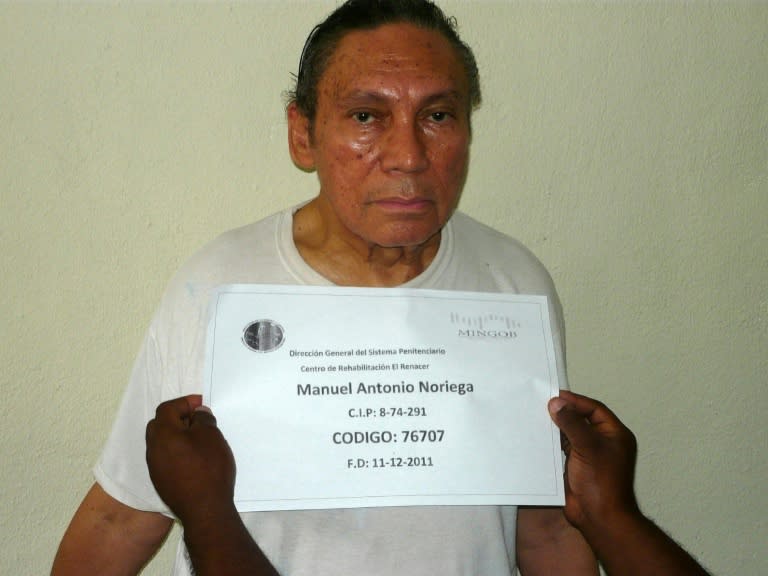 Former Panamanian dictator Manuel Noriega has his mug shot taken at El Renacer penitentiary, 25 km southeast of Panama City