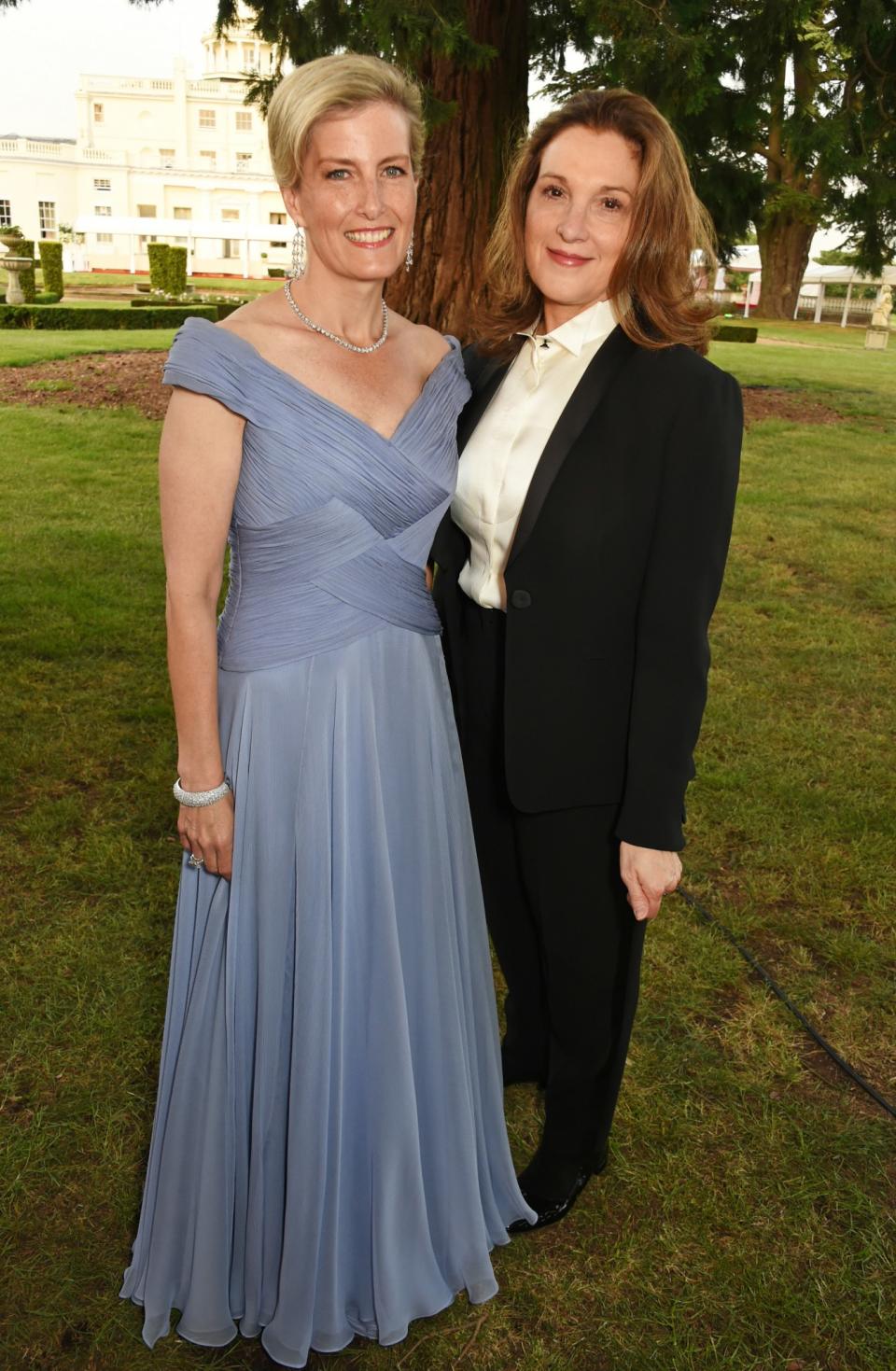 <p>Proving steel blue is her colour with Barbara Broccoli at Stoke Park in June [Photo: PA] </p>