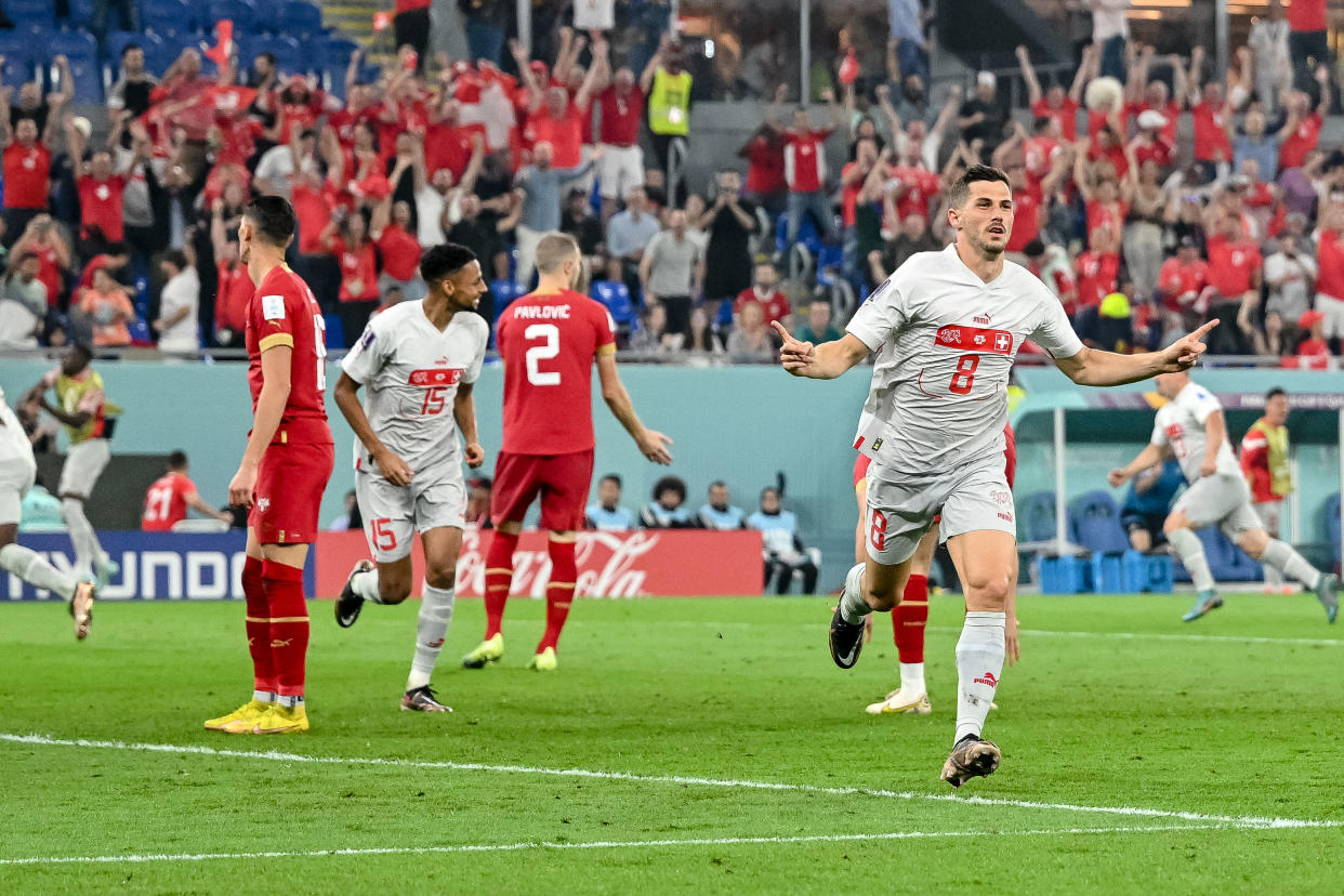 Switzerland's Remo Freuler celebrates after scoring his team's third goal during a FIFA World Cup match against Serbia on Dec. 2. (Harry Langer/DeFodi Images via Getty Images)