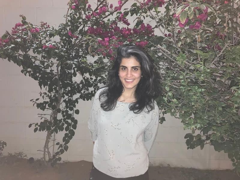 Women's rights activist Loujain al-Hathloul poses at home