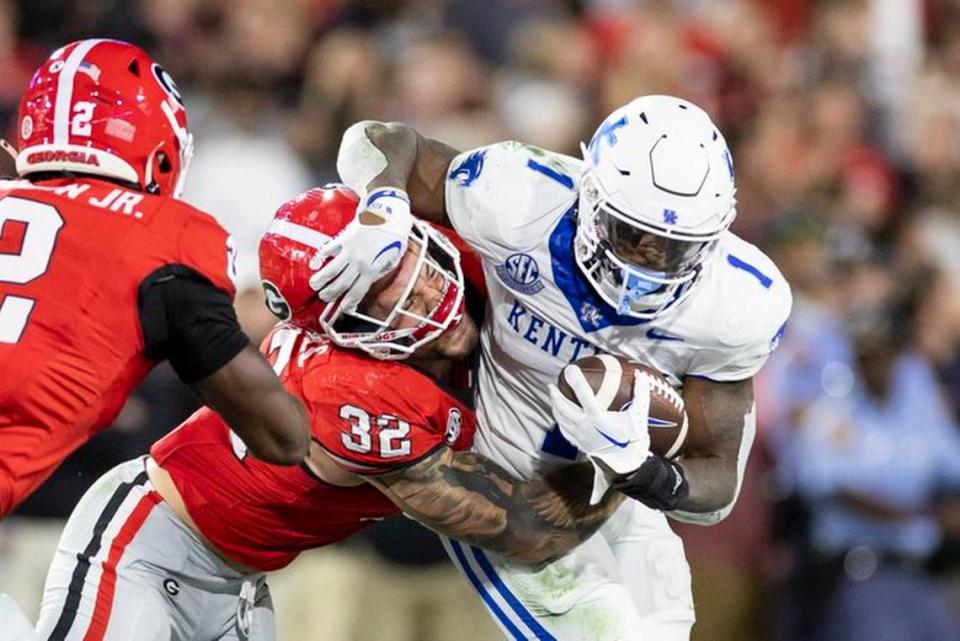 Kentucky’s Ray Davis (1) runs the ball against Georgia on Saturday, Oct. 7, 2023, at Sanford Stadium in Athens, Ga.