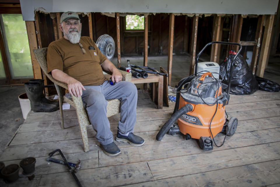 Ed Haggett, 70 poses for a portrait at his house in Montpelier, Vt., July 3, 2024, that was damaged by the 2023 flood. Haggett is waiting to hear whether the city or the Federal Emergency Management Agency will buy his home. A year after catastrophic flooding inundated parts of Vermont, some homeowners are still in the throes of recovery.