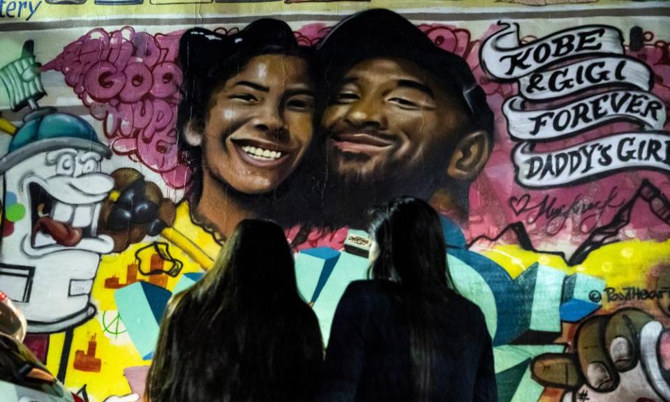 Fans pay their respects at a memorial for Kobe Bryant and his daughter Gianna in Los Angeles.