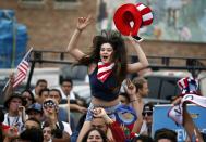 USA fans react during the 2014 World Cup Group G soccer match between Germany and the U.S. at a viewing party in Hermosa Beach, California June 26, 2014. REUTERS/Lucy Nicholson (UNITED STATES - Tags: SPORT SOCCER WORLD CUP)