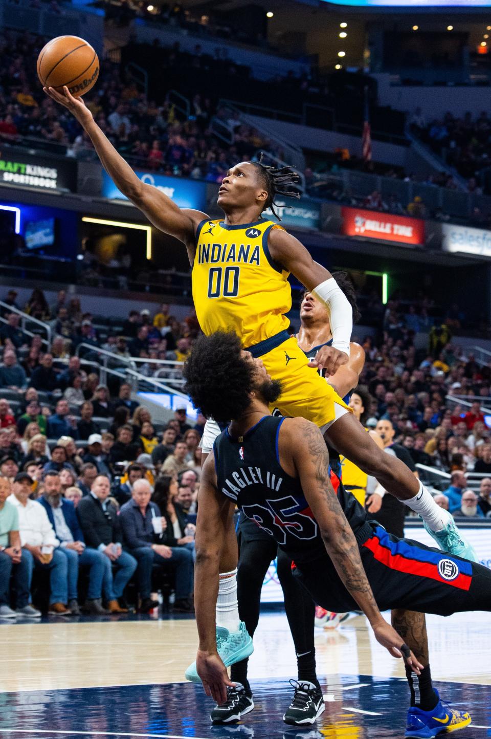 Apr 7, 2023; Indianapolis, Indiana, USA; Indiana Pacers guard Bennedict Mathurin (00) shoots the ball while Detroit Pistons forward Marvin Bagley III (35) defends in the first half at Gainbridge Fieldhouse. Mandatory Credit: Trevor Ruszkowski-USA TODAY Sports