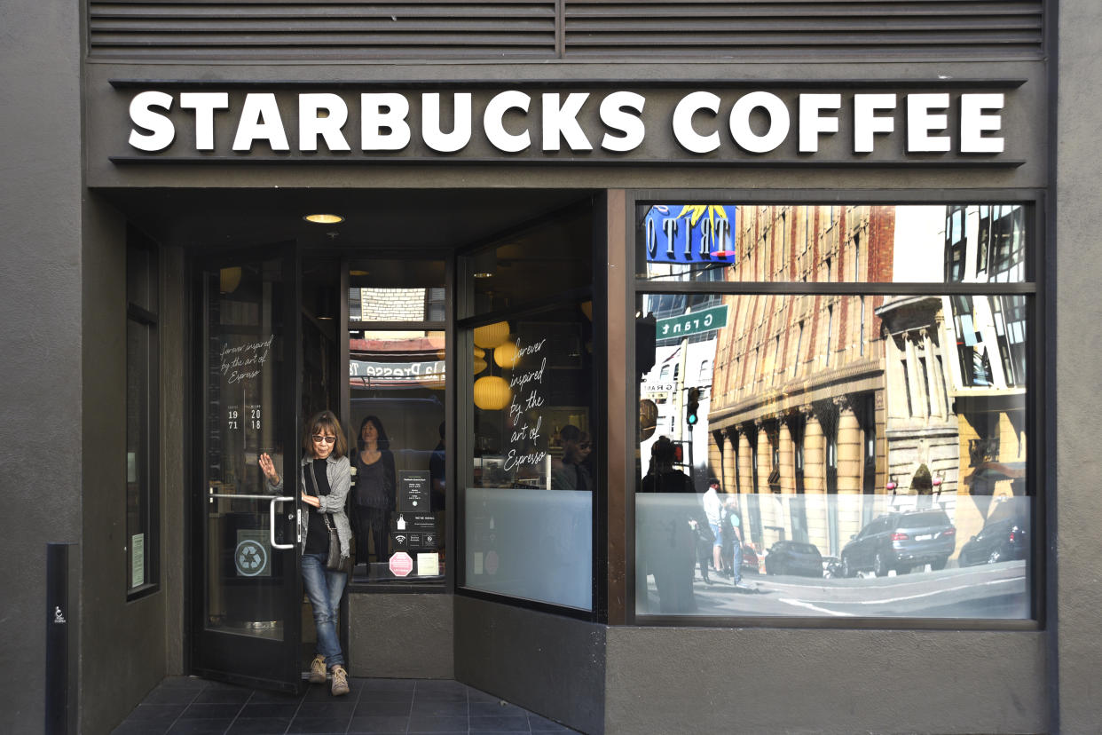 A customer leaves a Starbucks coffee shop in San Francisco, California.