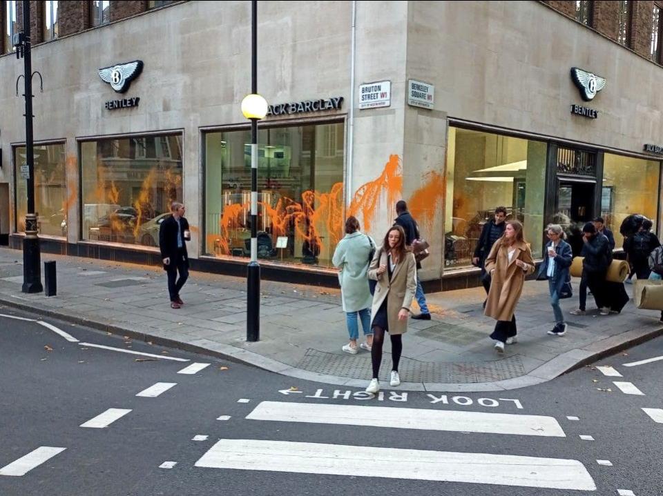 Just Stop Oil activists sprayed paint over car showrooms in Mayfair (Just Stop Oil)