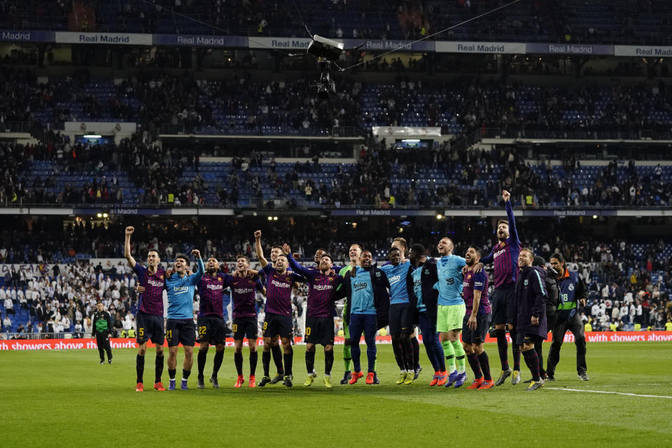 Barcelona players celebrate after winning the Spanish La Liga soccer match between Real Madrid and FC Barcelona at the Bernabeu stadium in Madrid, Saturday, March 2, 2019. (AP Photo/Andrea Comas)