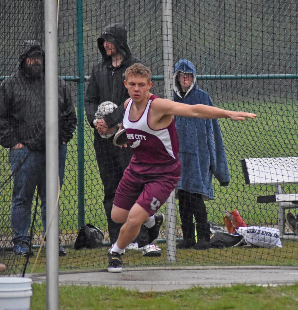 Union City's Logan Cole swept the throwing events at the Union City Invite on Friday, winning the shot put and discus