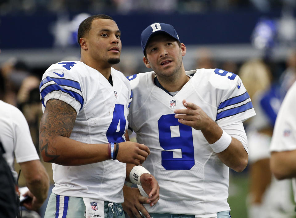 Dallas Cowboys' Dak Prescott (4) and Tony Romo (9) talk on the sideline in the first half of an NFL football game against the Baltimore Ravens on Sunday, Nov. 20, 2016, in Arlington, Texas. (AP Photo/Michael Ainsworth)