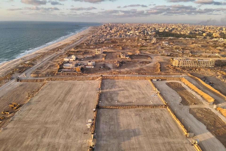 Israeli military handout photo showing a holding area for aid lorries next to the beach where the US floating pier is anchored (16 May 2024)