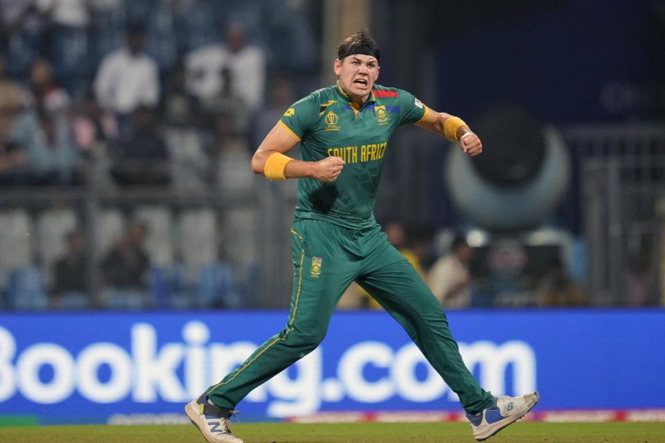 South Africa's Gerald Coetzee celebrates the wicket of Bangladesh's Mushfiqur Rahim during the ICC Men's Cricket World Cup match between Bangladesh and South Africa in Mumbai, India, Tuesday, Oct. 24, 2023. (AP Photo/Rajanish Kakade)