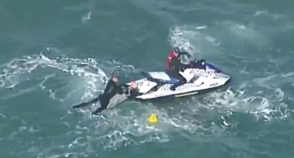 Queensland Police divers looking for the Yak-52 plane's wreckage off the Gold Coast. Source: Nine News