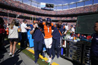 Denver Broncos wide receiver K.J. Hamler if helped off the field after an injury against the New York Jets during the first half of an NFL football game, Sunday, Sept. 26, 2021, in Denver. (AP Photo/Jack Dempsey)