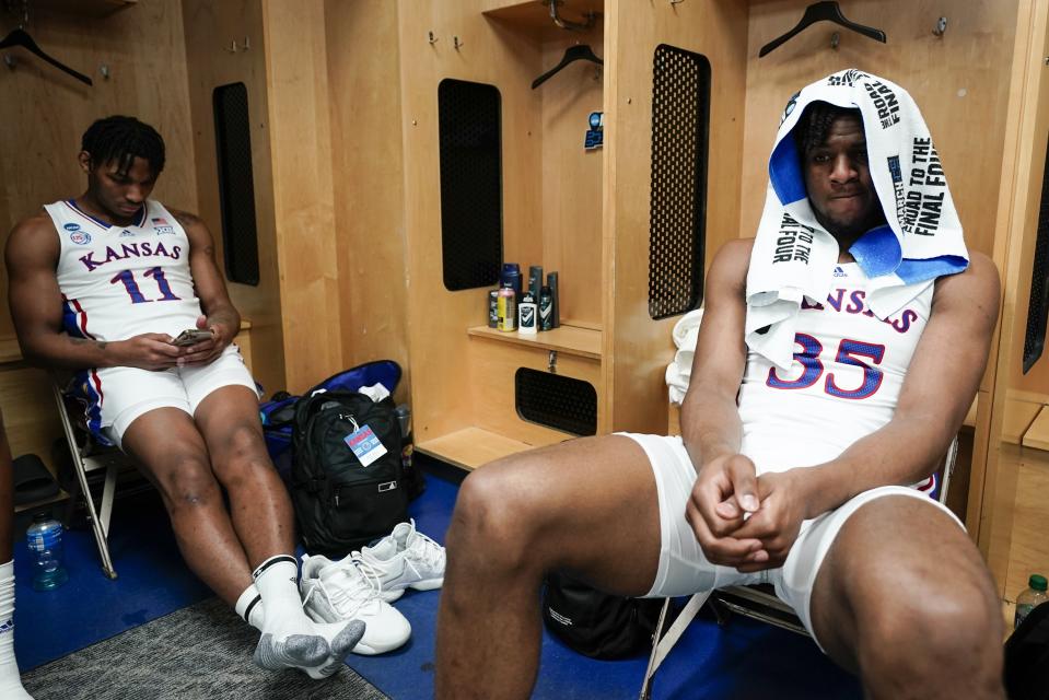 Kansas' Zuby Ejiofor and MJ Rice react after a second-round college basketball game against Arkansas in the NCAA Tournament Saturday, March 18, 2023, in Des Moines, Iowa. Arkansas won 72-71. (AP Photo/Morry Gash)