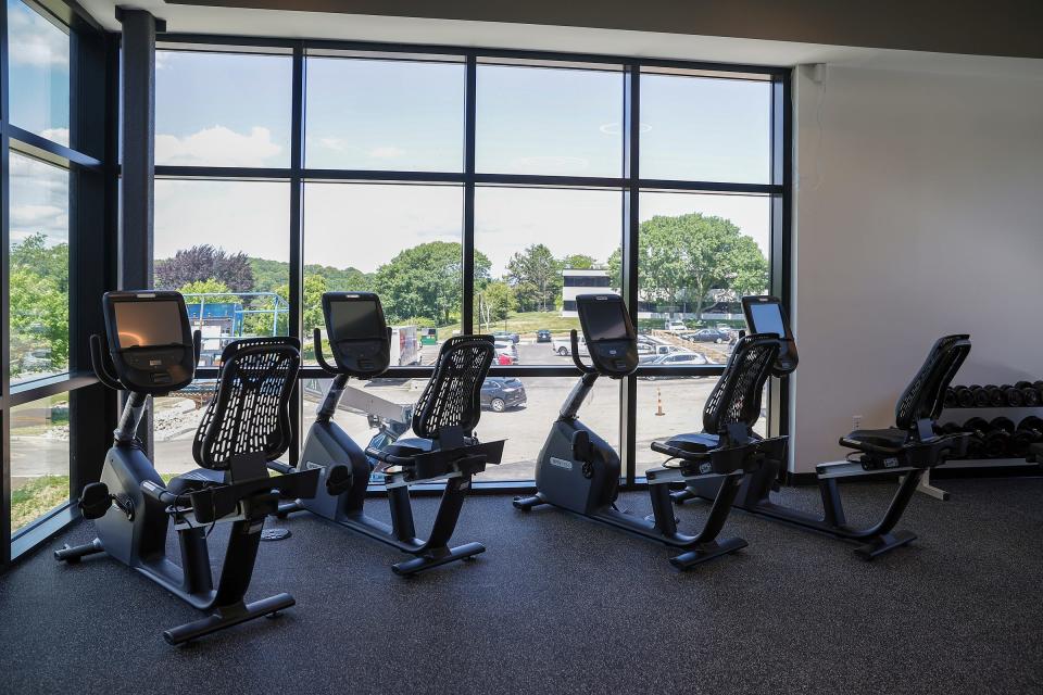 The second-floor wellness center has a view of the parking lot and Green End Pond.