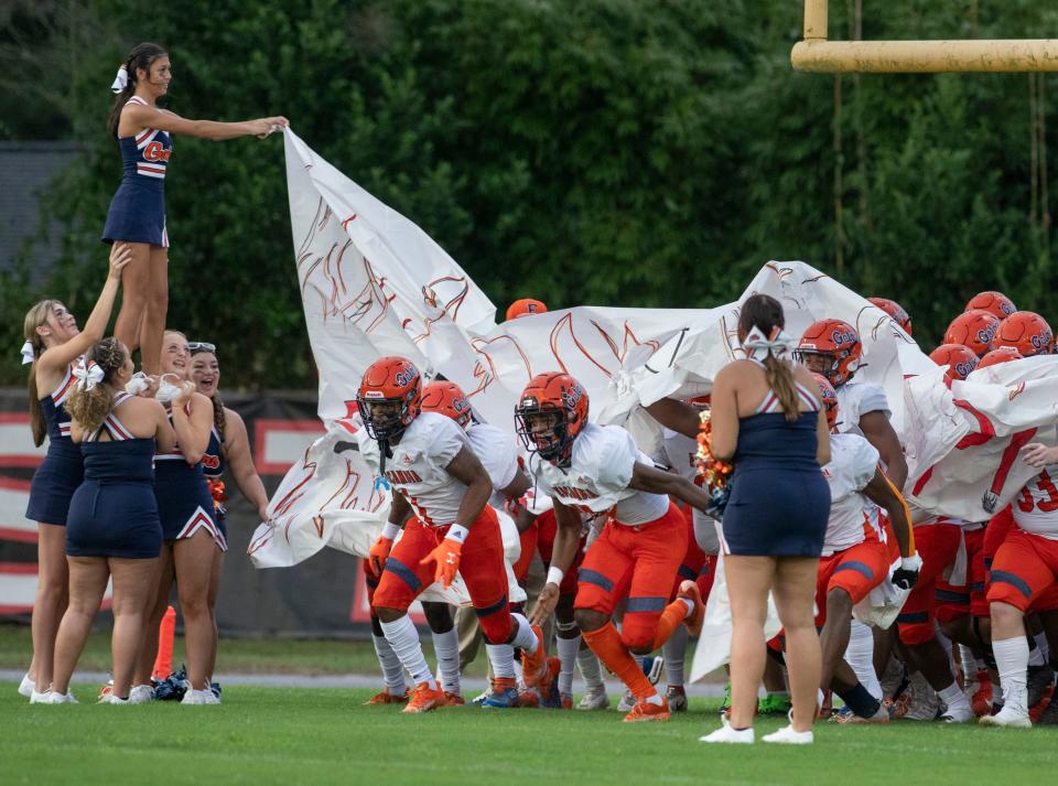 The Gators take the field for the Escambia vs West Florida football game at West Florida High School in Pensacola on Friday, Aug. 26, 2022.