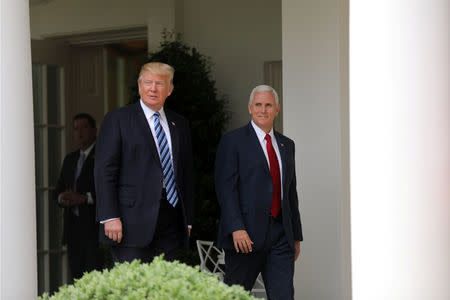 U.S. President Donald Trump and Vice President Mike Pence attend a National Day of Prayer event at the Rose Garden of the White House in Washington D.C., U.S., May 4, 2017. REUTERS/Carlos Barria