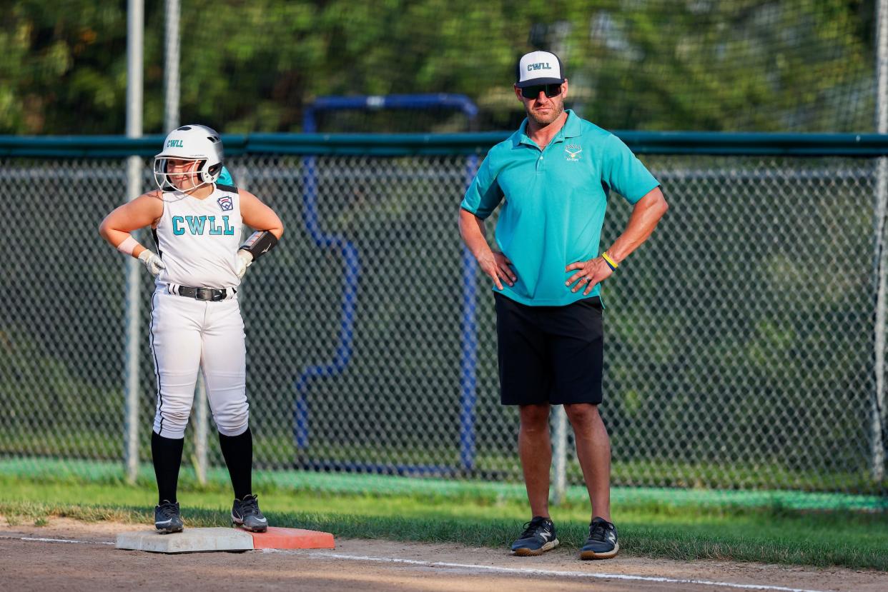 Craig Stinson working as an assistant coach for the Cranston Western softball team.