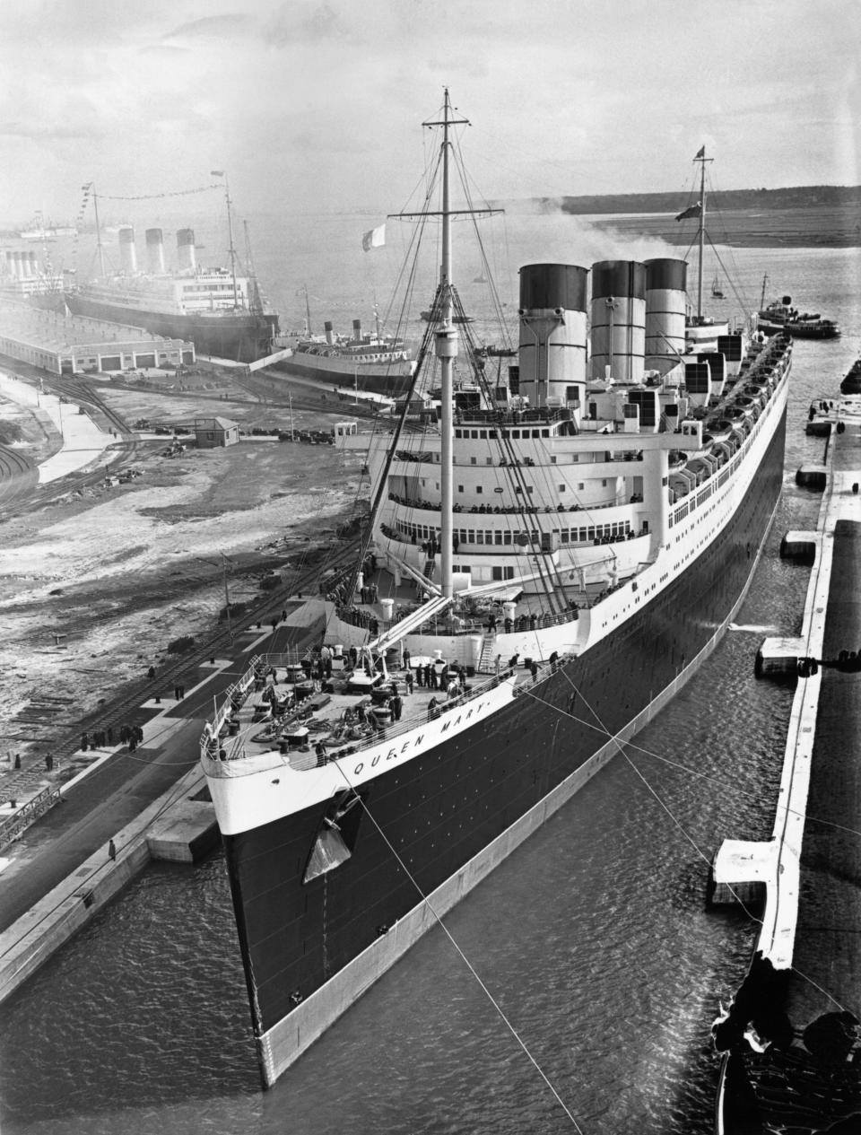 black and white photo of a docked ship