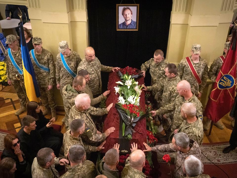 Servicemen pay their last respects to volunteer soldier Oleksandr Shapoval, a ballet dancer soloist of the National Opera, killed in a battle in Donetsk (AP)