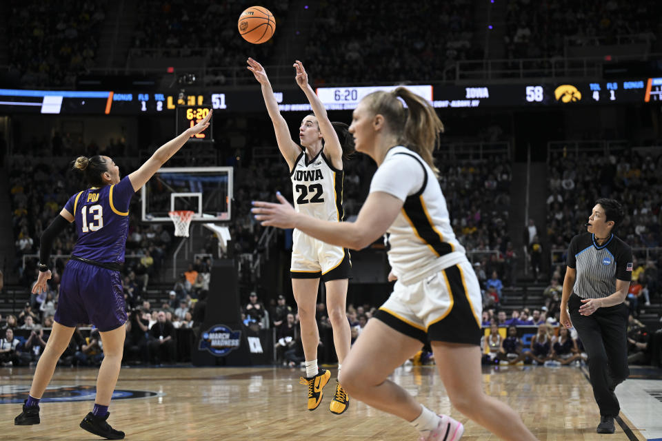 Iowa guard Caitlin Clark (22) puts up a three-point shot against LSU during the third quarter of an Elite Eight round college basketball game during the NCAA Tournament, Monday, April 1, 2024, in Albany, N.Y. (AP Photo/Hans Pennink)