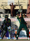 South African cricket captain AB de Villiers (R) plays a shot as Pakistani wicket keeper Umar Akmal looks on during the fifth and final one-day at the Sharjah Cricket Stadium in Sharjah on November 11, 2013. South Africa are winning the five-match series with an unbeatable 3-1 lead. AFP PHOTO/ASIF HASSAN