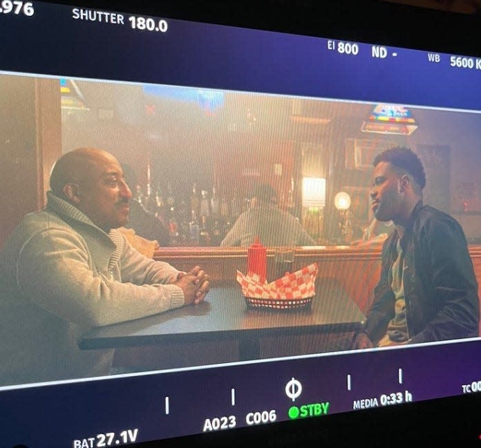 From left, Naheem Garcia and Daniel Washington appear on camera in a scene being filmed for "Money Game," an independent film, on April 9.