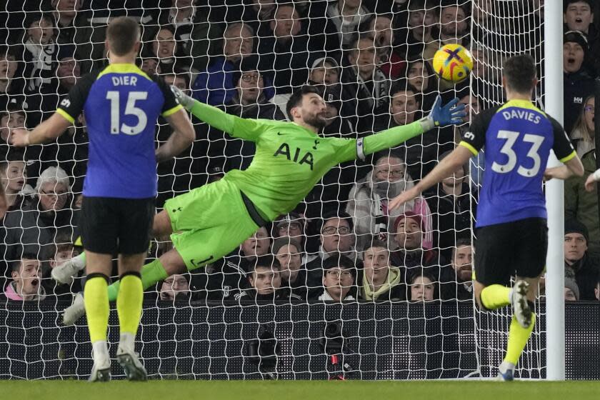 Tottenham goalkeeper Hugo Lloris makes a save during a match against Fulham