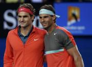 Roger Federer (L) of Switzerland poses for a photo with Rafael Nadal of Spain before their men's singles semi-final match at the Australian Open 2014 tennis tournament in Melbourne January 24, 2014. REUTERS/Jason Reed