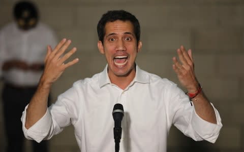 Venezuelan opposition leader Juan Guaido, talks to the media during a news conference, in Cucuta - Credit: Reuters