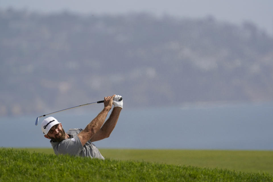 Dustin Johnson hits from the fourth fairway during the first round of the U.S. Open Golf Championship, Thursday, June 17, 2021, at Torrey Pines Golf Course in San Diego. (AP Photo/Gregory Bull)