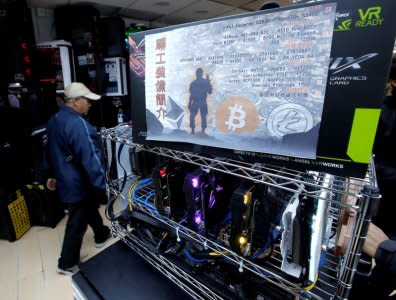 A cryptocurrency mining computer equipped with high-end graphic cards is seen on display at a computer mall in Hong Kong, China January 29, 2018. Picture taken January 29, 2018.  REUTERS/Bobby Yip