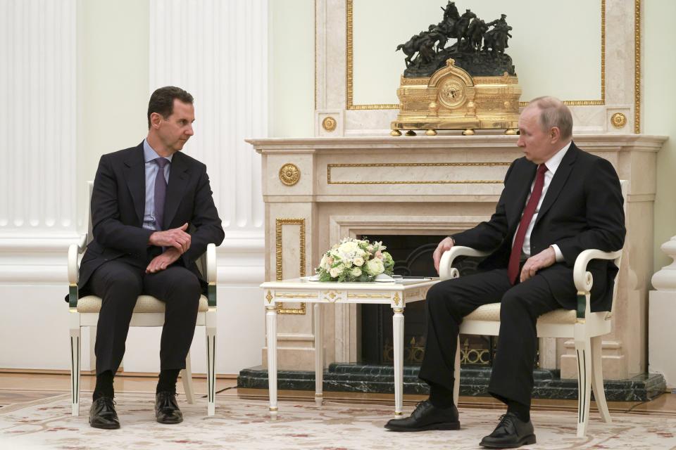 Russian President Vladimir Putin, right, listens to Syrian President Bashar Assad during their meeting at the Kremlin in Moscow, Russia, Wednesday, March 15, 2023. (Vladimir Gerdo, Sputnik, Kremlin Pool Photo via AP)