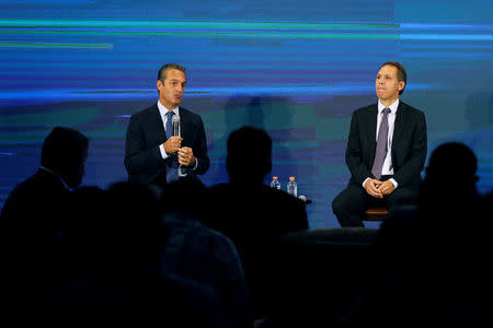 Chairman of the Board of Directors of Grupo Carso, Carlos Slim Domit (L), speaks next to Telcel CEO Daniel Hajj Aboumrad during a news conference at America Movil's corporate offices in Mexico City, Mexico March 14, 2018. REUTERS/Carlos Jasso