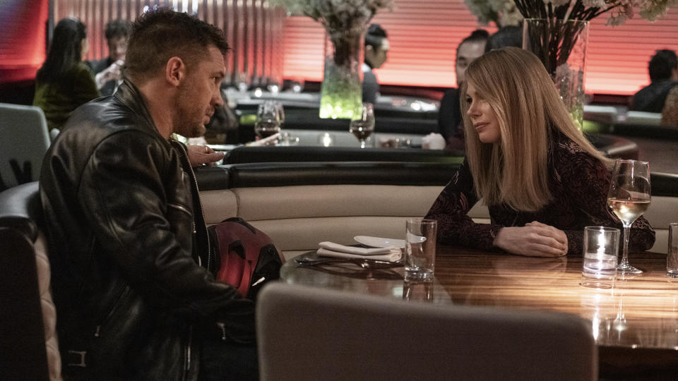 This image released by Sony Pictures shows Tom Hardy, left, and Michelle Williams in a scene from "Venom: Let There Be Carnage." (Jay Maidment/Sony Pictures Entertainment via AP)