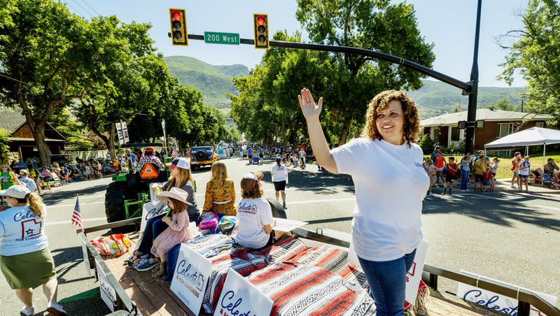 Celeste Maloy, congressional candidate, waves as she rides in a parade in Farmington on Saturday, July 15, 2023.