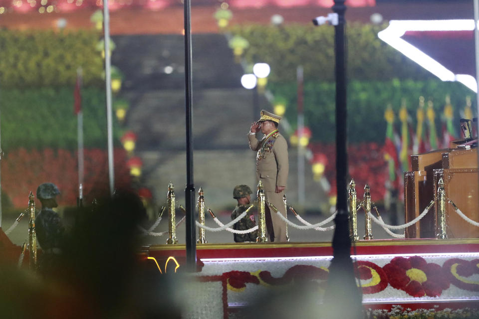 Senior Gen. Min Aung Hlaing, head of the military council, salutes on stage during a parade to commemorate Myanmar's 79th Armed Forces Day, in Naypyitaw, Myanmar, Wednesday, March 27, 2024. (AP Photo/Thein Zaw)