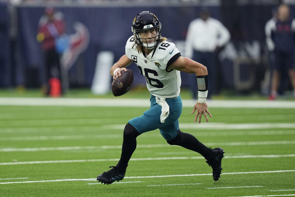 Jacksonville Jaguars quarterback Trevor Lawrence (16) looks to pass against the Houston Texans during the second half of an NFL football game in Houston, Sunday, Jan. 1, 2023. (AP Photo/David J. Phillip)