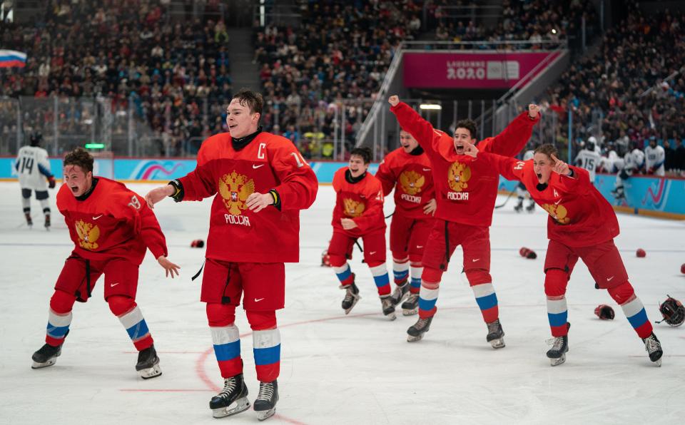 Jan 21, 2020; Lausanne, SWITZERLAND;   Nikita Ryzhov RUS (18), Ivan Miroshnichenko RUS (10) and their team mates celebrate their victory in the RUS v USA Final of the Ice Hockey 6-Teams Men's competition at Vaudoise Arena. The Winter Youth Olympic Games. Mandatory Credit: Thomas Lovelock/OIS Handout Photo via USA TODAY Sports