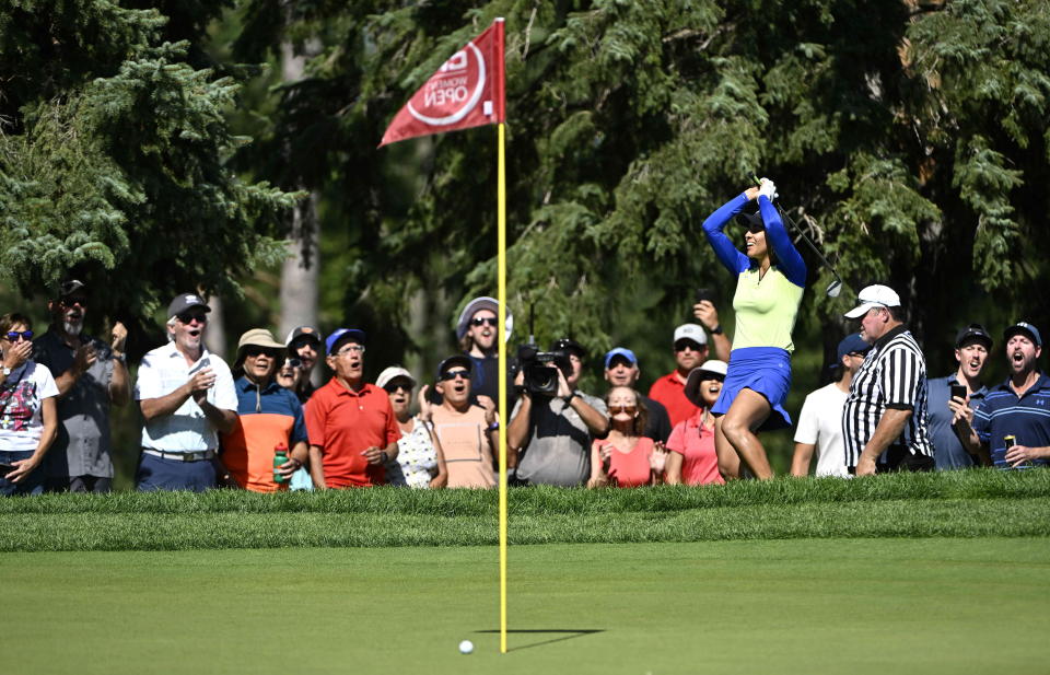 Paula Reto, of South Africa, raises her golf club over her head as fans shout, after her chip came up short on the green of the 17th hole during the final round of the Canadian Pacific Women's Open golf tournament in Ottawa, on Sunday, Aug. 28, 2022. (Justin Tang/The Canadian Press via AP)