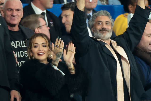 <p>Jean Catuffe/Getty</p> Rita Ora and Taika Waititi attend the Rugby World Cup in Paris