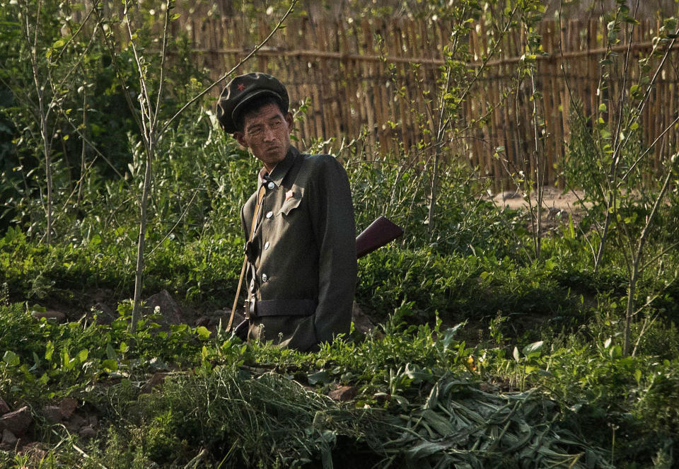 <p>A North Korean soldier guards on the Yalu river north of the border city of Sinuiju, North Korea across from Dandong, Liaoning province, northern China on May 24, 2017 in Dandong, China. (Photo: Kevin Frayer/Getty Images) </p>