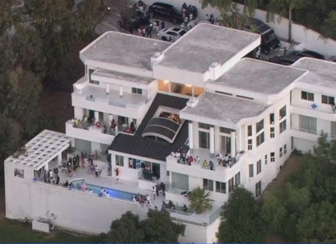 Dozens of people seen at the mansion party on Monday, August 3, 2020, hours before the shooting occurred. / Credit: CBS Los Angeles