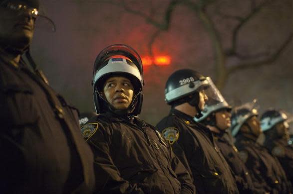 Police officers stand together at Union Square in New York March 22, 2012.